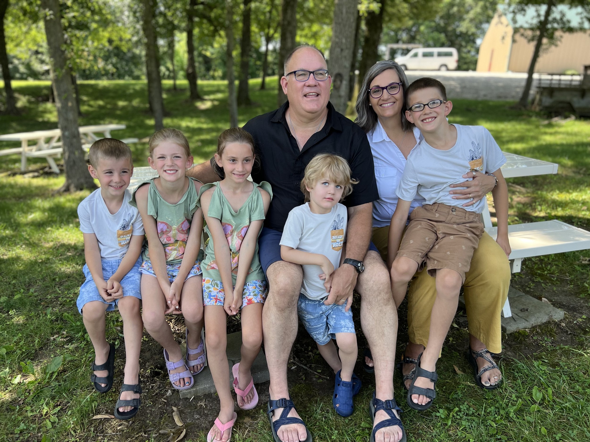 five-sons-family-photo-on-picnic-table